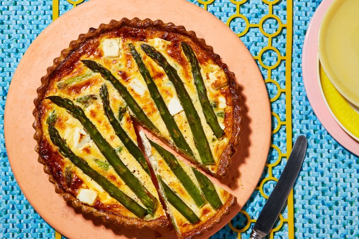 Asparagus,-feta-&-dill-quiche Asparagus, feta and dill quiche on a plate