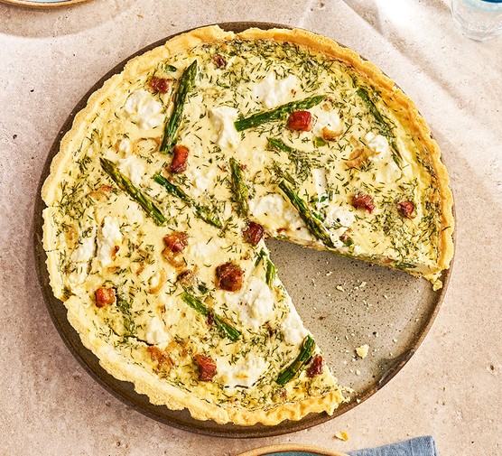 One asparagus, pancetta & goat's cheese quiche cut into slices