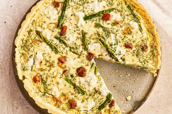 Asparagus, pancetta & goat's cheese quiche Asparagus, pancetta & goat's cheese quiche with a slice removed