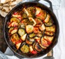 Aubergine, halloumi & harissa bake in a skillet pan