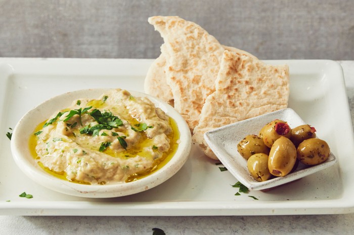 Baba ganoush dip Bowl of baba ganoush dip with pitta bread and olives