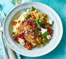 Chicken tagine with lemons, olives & pomegranate served in a bowl