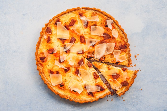 Liberty's smoky chorizo & manchego cheese quiche An aerial shot of a chorizo quiche with one slice taken out of it