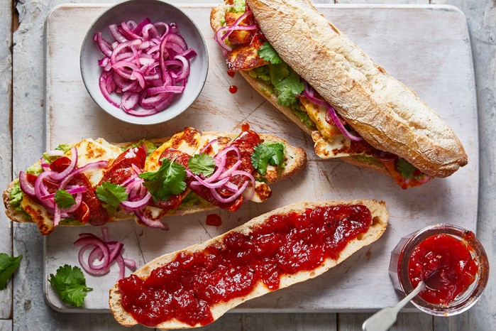 Chorizo & halloumi baguette Sliced of baguette topped with chorizo jam, halloumi and relish