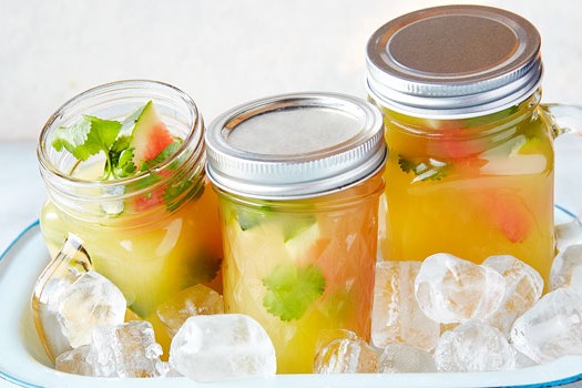 Coconut pineapple cooler Three jam-jar cocktails in an iced dish