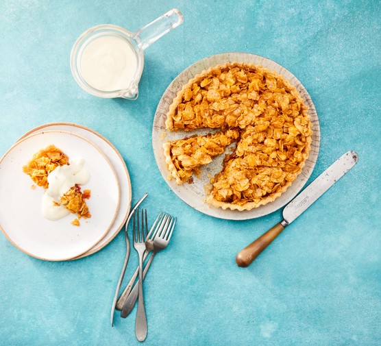Cornflake tart sliced with cream
