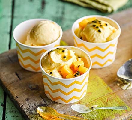 Frozen tropical fruit yogurt served in tubs
