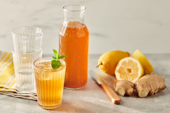 Homemade ginger beer Glasses and vial filled with ginger beer