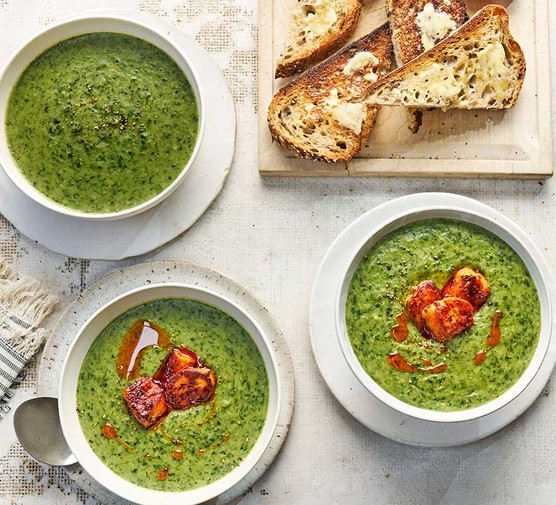 Leafy greens soup with chilli-honey halloumi croutons Leafy greens soup with chilli-honey halloumi croutons served in several bowls