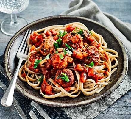 Healthy freezable recipes A plate serving slow cooker meatballs with spaghetti