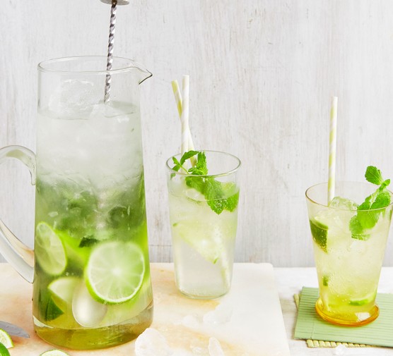 Jug of mojito next to two glasses