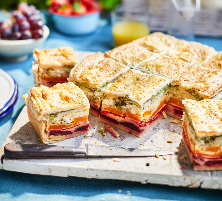 Top 60 picnic recipes A layered vegetable pie cut into squares on a chopping board