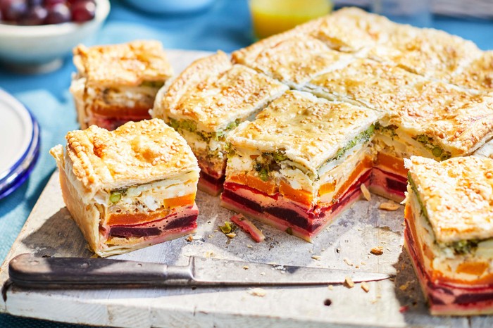Rainbow picnic pie A square-shaped picnic pie cut into squares