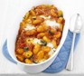 Gnocchi & tomato bake Gnocchi & tomato bake in a serving dish with spoon