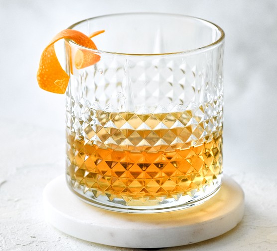 Father's Day cocktail recipes Sazerac in a glass with orange peel garnish