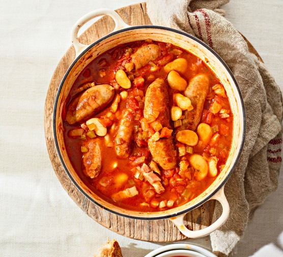 20 best batch-cooking family recipes Sausage casserole in a dish on a serving board