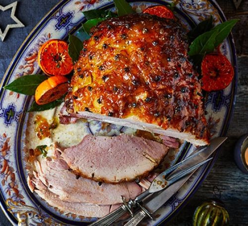 New Year's Eve recipes Glazed sliced ham with cloves and citrus pieces