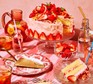 Strawberry lemonade cake Strawberry lemonade cake on a cake stand with a slice cut out