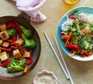Tofu stir-fry in a wok and a bowl