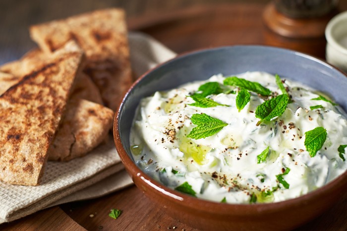 tzatziki Small bowl of tzatziki with pitta bread