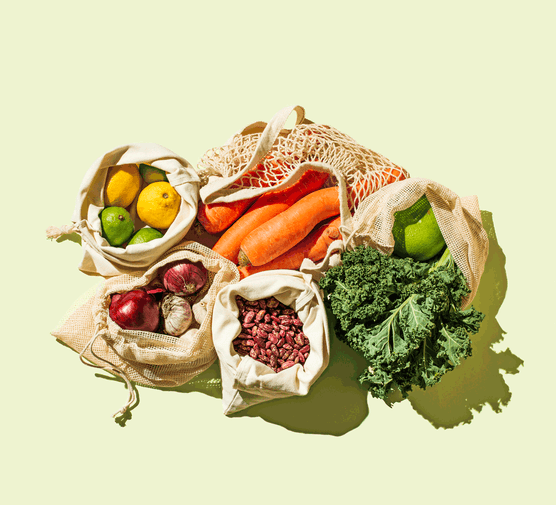 Paper bags of various fruit and vegetables